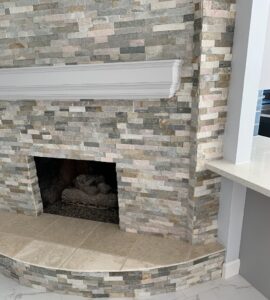 After - stacked stone fireplace